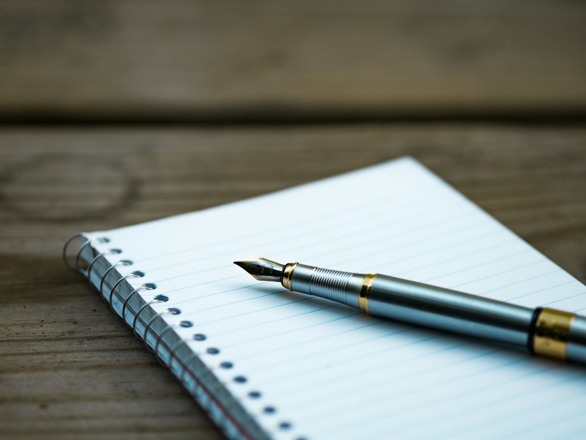 Notebook and fountain pen for planning a consultation.